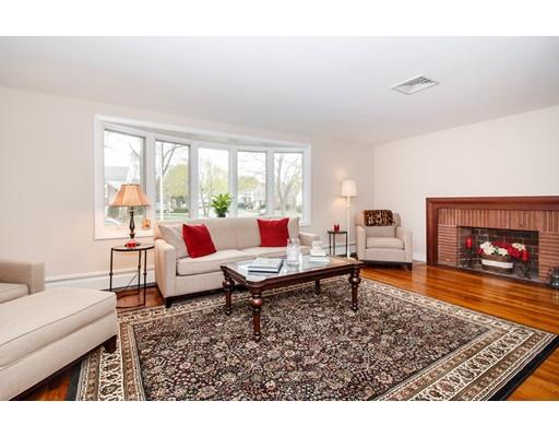 9 Sandrick Road Belmont, MA 02478 - Photo 2 of 21 a living room with furniture a rug and a fireplace