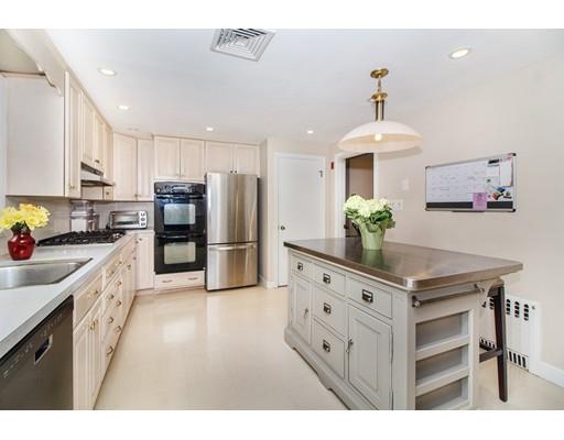 9 Sandrick Road Belmont, MA 02478 - Photo 7 of 21 a kitchen with refrigerator a stove a sink and cabinets