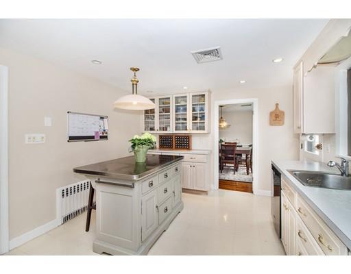9 Sandrick Road Belmont, MA 02478 - Photo 8 of 21 a kitchen with stainless steel appliances kitchen island a sink stove and cabinets