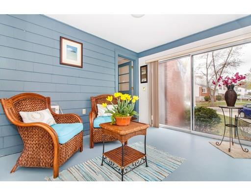 9 Sandrick Road Belmont, MA 02478 - Photo 10 of 21 a living room filled with furniture and a potted plant