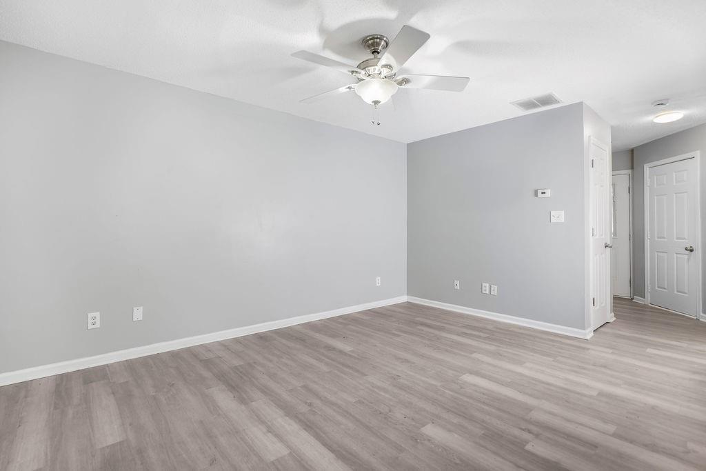 6947 Gallant Circle Southeast, Unit 10 Mableton, GA 30126 - Photo 12 of 26 a view of an empty room with wooden floor