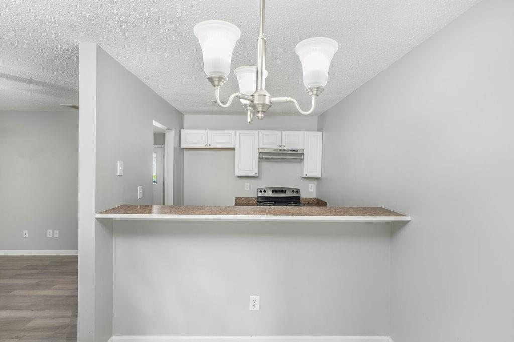 6947 Gallant Circle Southeast, Unit 10 Mableton, GA 30126 - Photo 13 of 26 a kitchen with stainless steel appliances a sink and a counter top