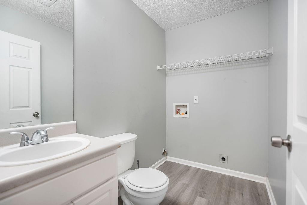 6947 Gallant Circle Southeast, Unit 10 Mableton, GA 30126 - Photo 16 of 26 a bathroom with a granite countertop sink toilet and shower