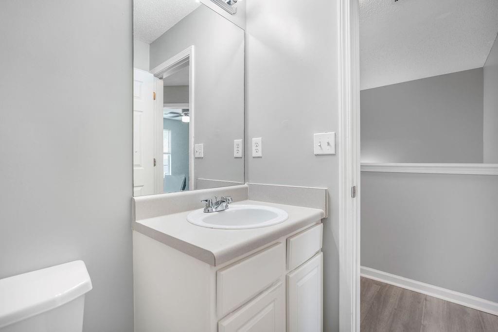 6947 Gallant Circle Southeast, Unit 10 Mableton, GA 30126 - Photo 18 of 26 a bathroom with a sink and a mirror