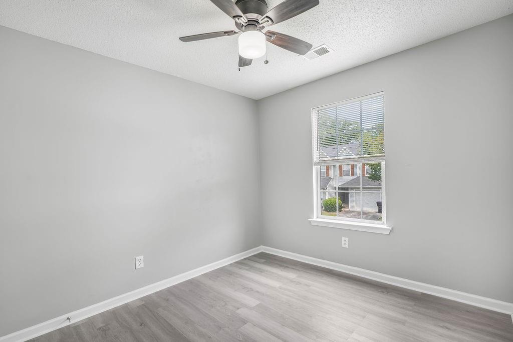 6947 Gallant Circle Southeast, Unit 10 Mableton, GA 30126 - Photo 19 of 26 an empty room with a window and a fan