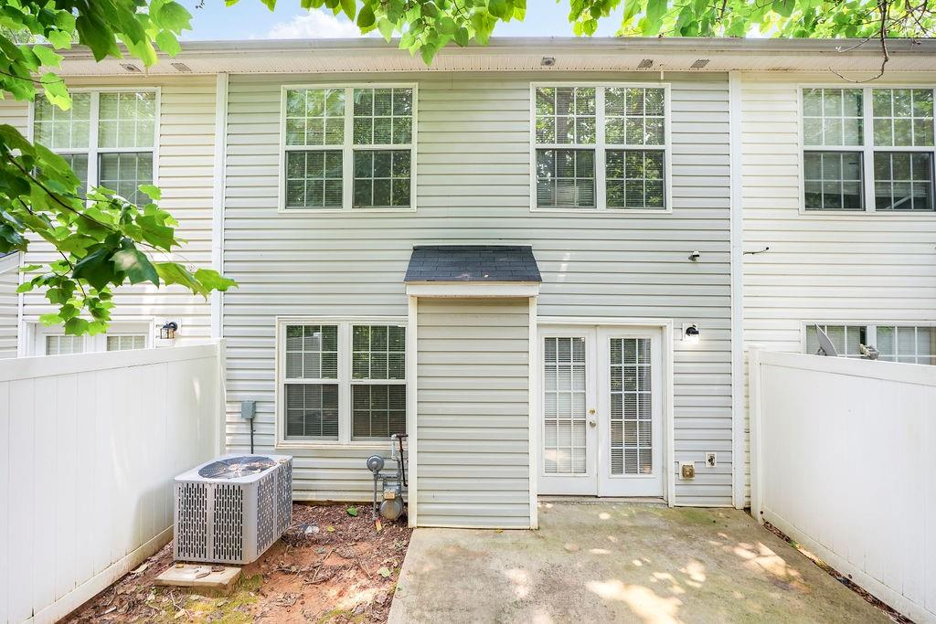 6947 Gallant Circle Southeast, Unit 10 Mableton, GA 30126 - Photo 24 of 26 a front view of a house with a garden