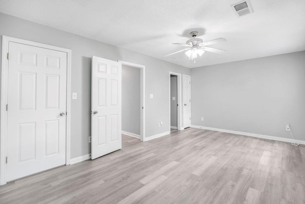 6947 Gallant Circle Southeast, Unit 10 Mableton, GA 30126 - Photo 3 of 26 a view of an empty room with wooden floor