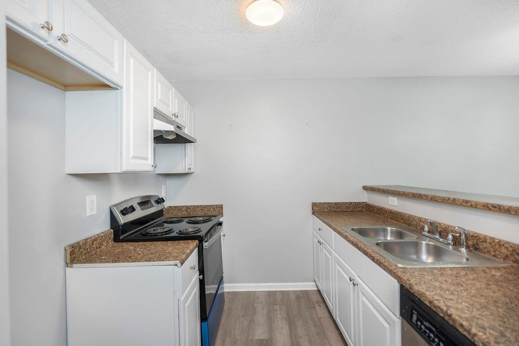 6947 Gallant Circle Southeast, Unit 10 Mableton, GA 30126 - Photo 6 of 26 a kitchen that has a sink and a stove
