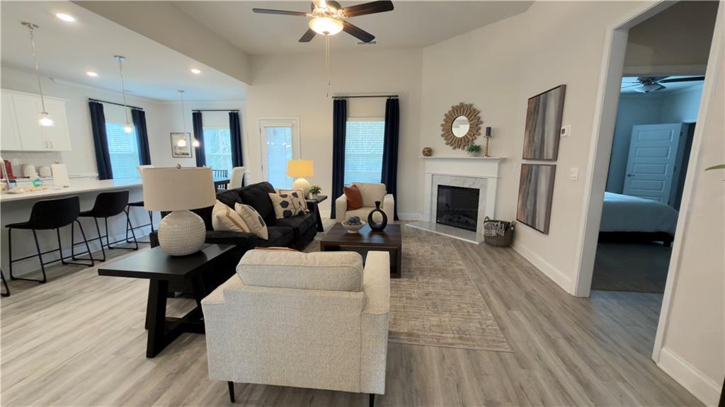 620 Bald Ridge Circle Demorest, GA 30535 - Photo 6 of 43 a living room with furniture fireplace and wooden floor