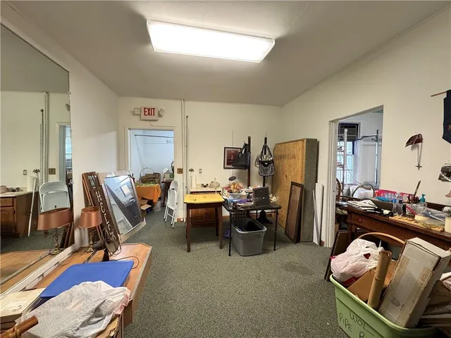 a view of a workspace with furniture and a couch