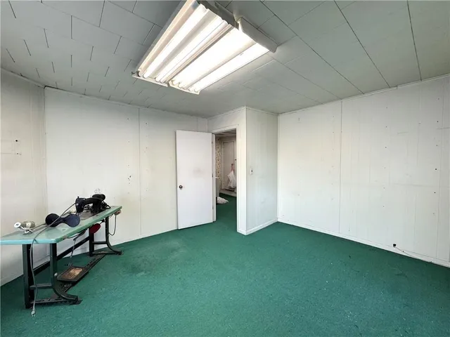 a view of room with window and a projector