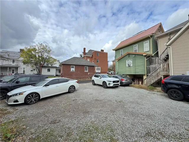 a car parked in front of a house