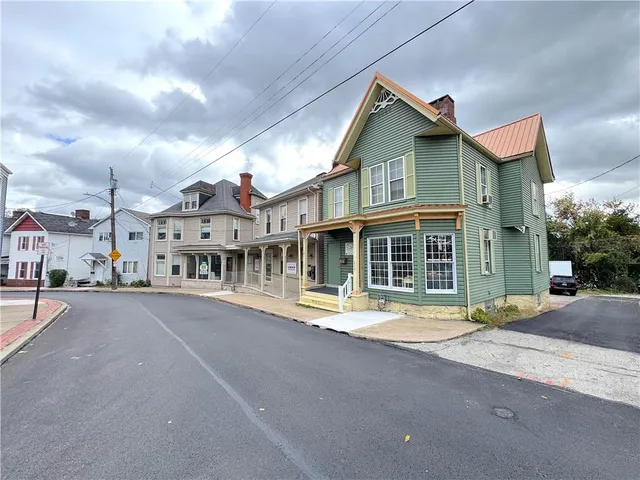a front view of a building with a street