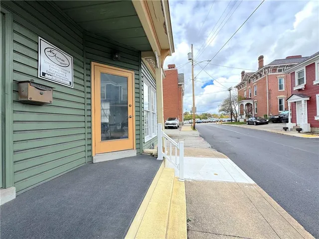 a view of a building with a street