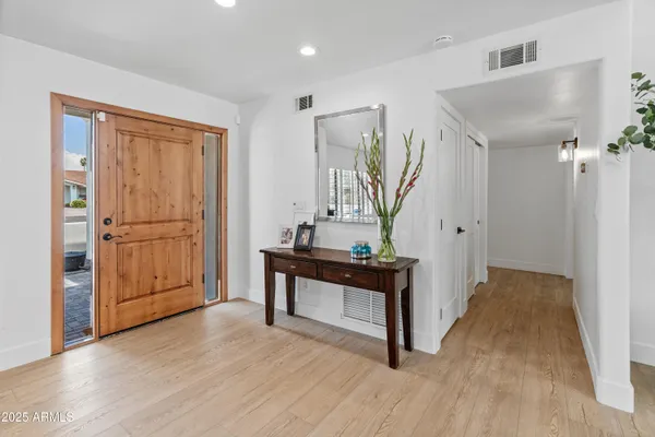 a view of dining room with furniture and wooden floor