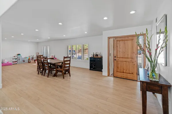 a living room with furniture and kitchen view