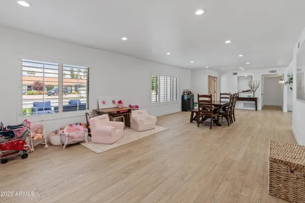 a bedroom with furniture and a wooden floor