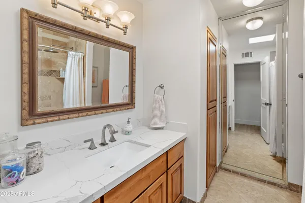 a bathroom with a shower and a bath tub