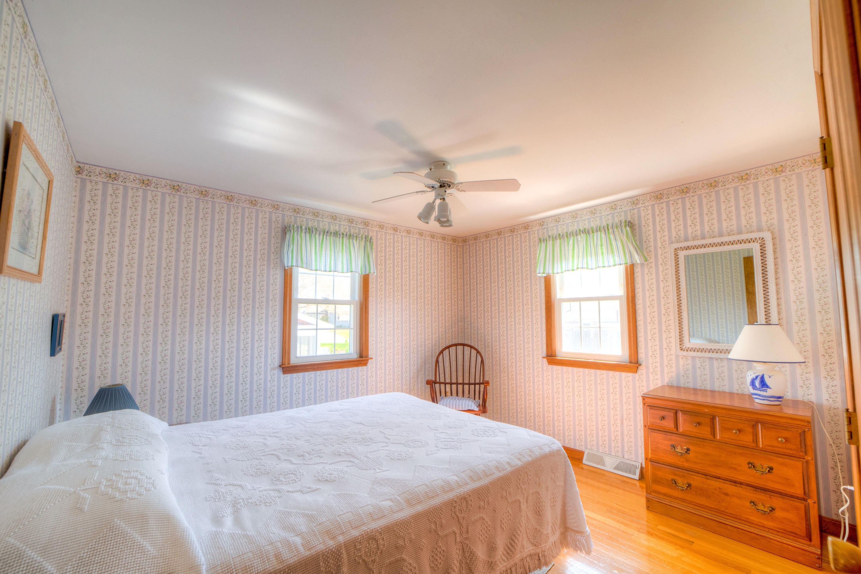 132 Indian Pond Road West Dennis, MA 02670 - Photo 11 of 21 a bedroom with a bed and a dresser with mirror
