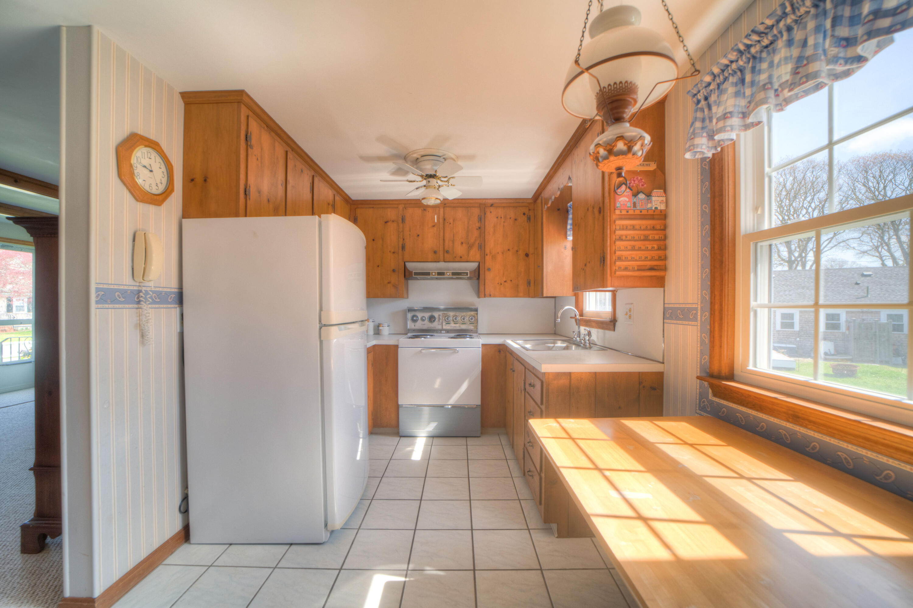 132 Indian Pond Road West Dennis, MA 02670 - Photo 12 of 21 a kitchen with stainless steel appliances granite countertop a refrigerator a sink and dishwasher