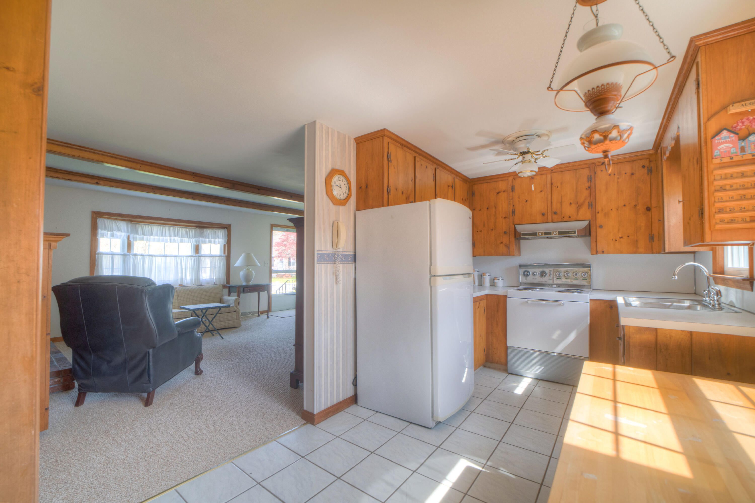 132 Indian Pond Road West Dennis, MA 02670 - Photo 13 of 21 a kitchen with refrigerator and cabinets
