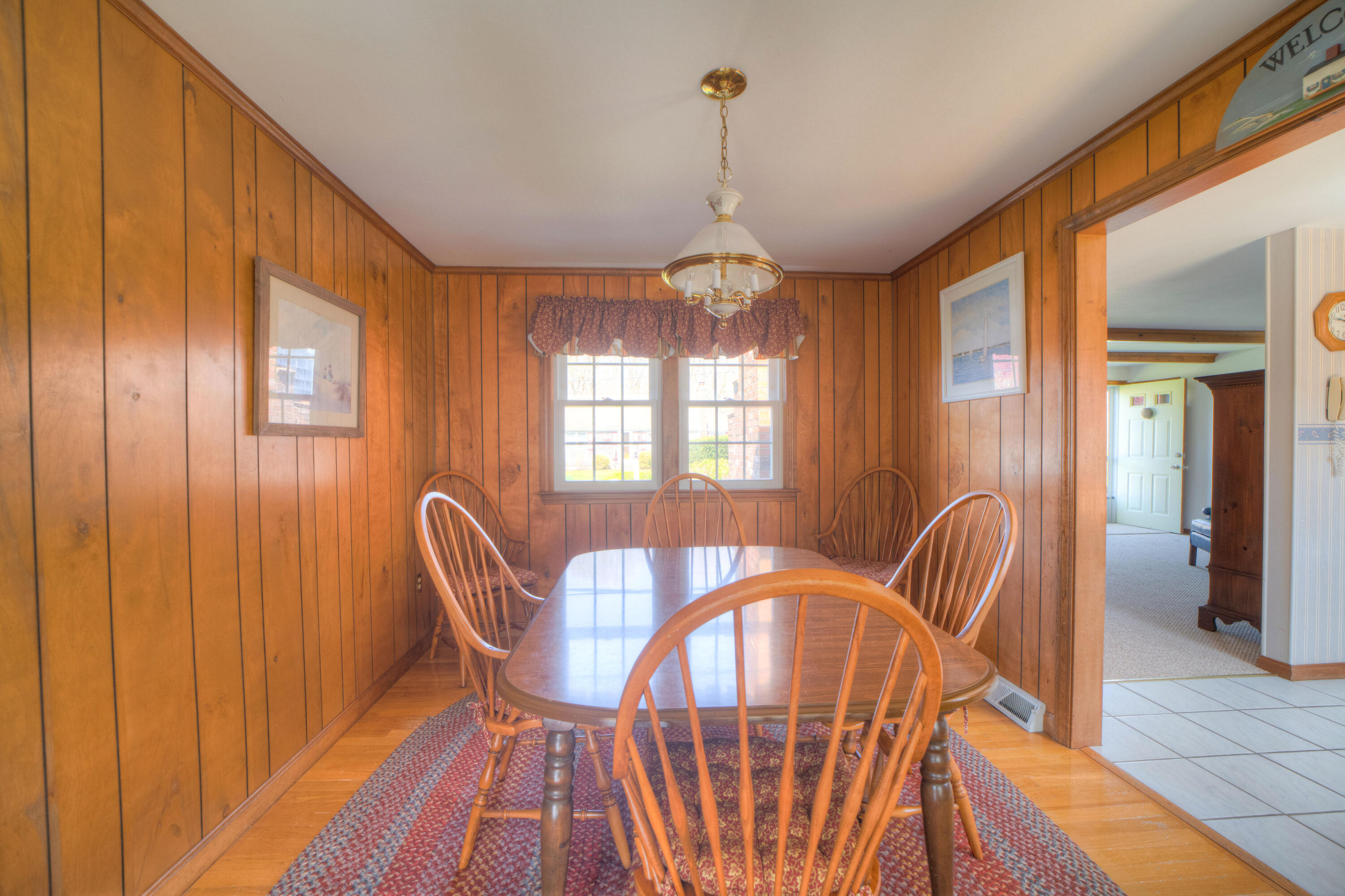132 Indian Pond Road West Dennis, MA 02670 - Photo 15 of 21 a view of a dining room with furniture window and wooden floor