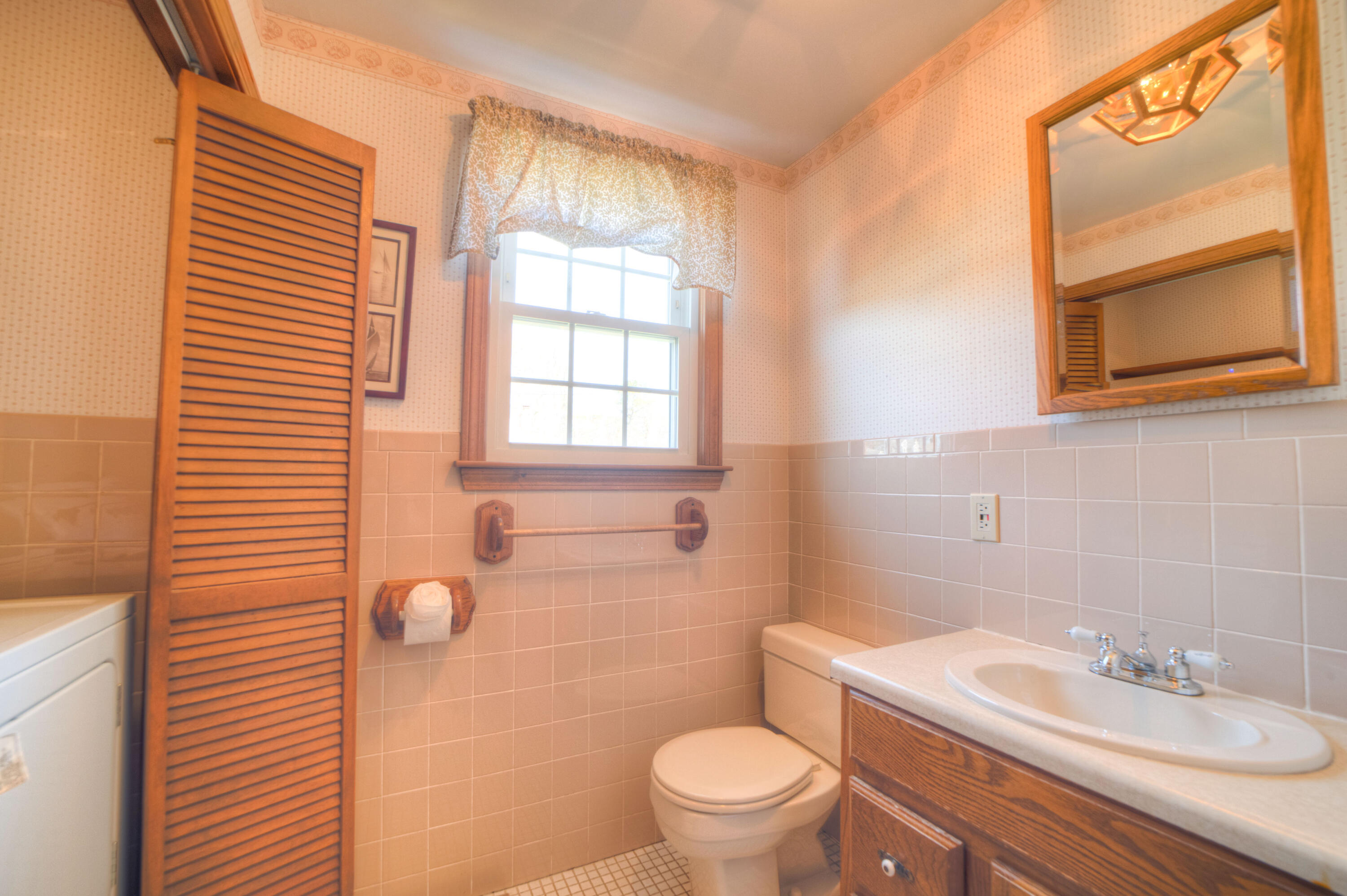 132 Indian Pond Road West Dennis, MA 02670 - Photo 18 of 21 a bathroom with a sink a toilet and tub