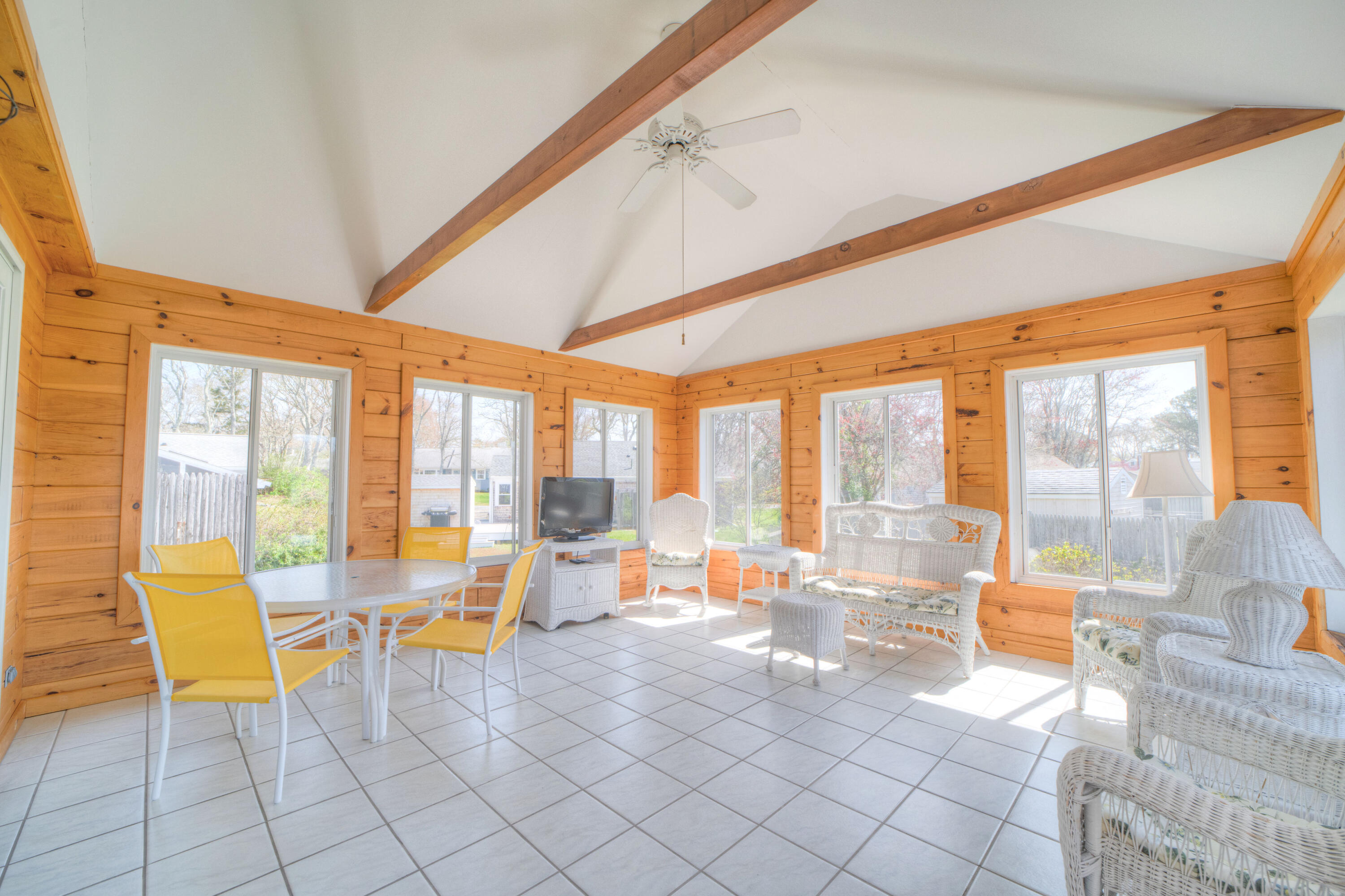 132 Indian Pond Road West Dennis, MA 02670 - Photo 19 of 21 a living room with furniture and floor to ceiling windows