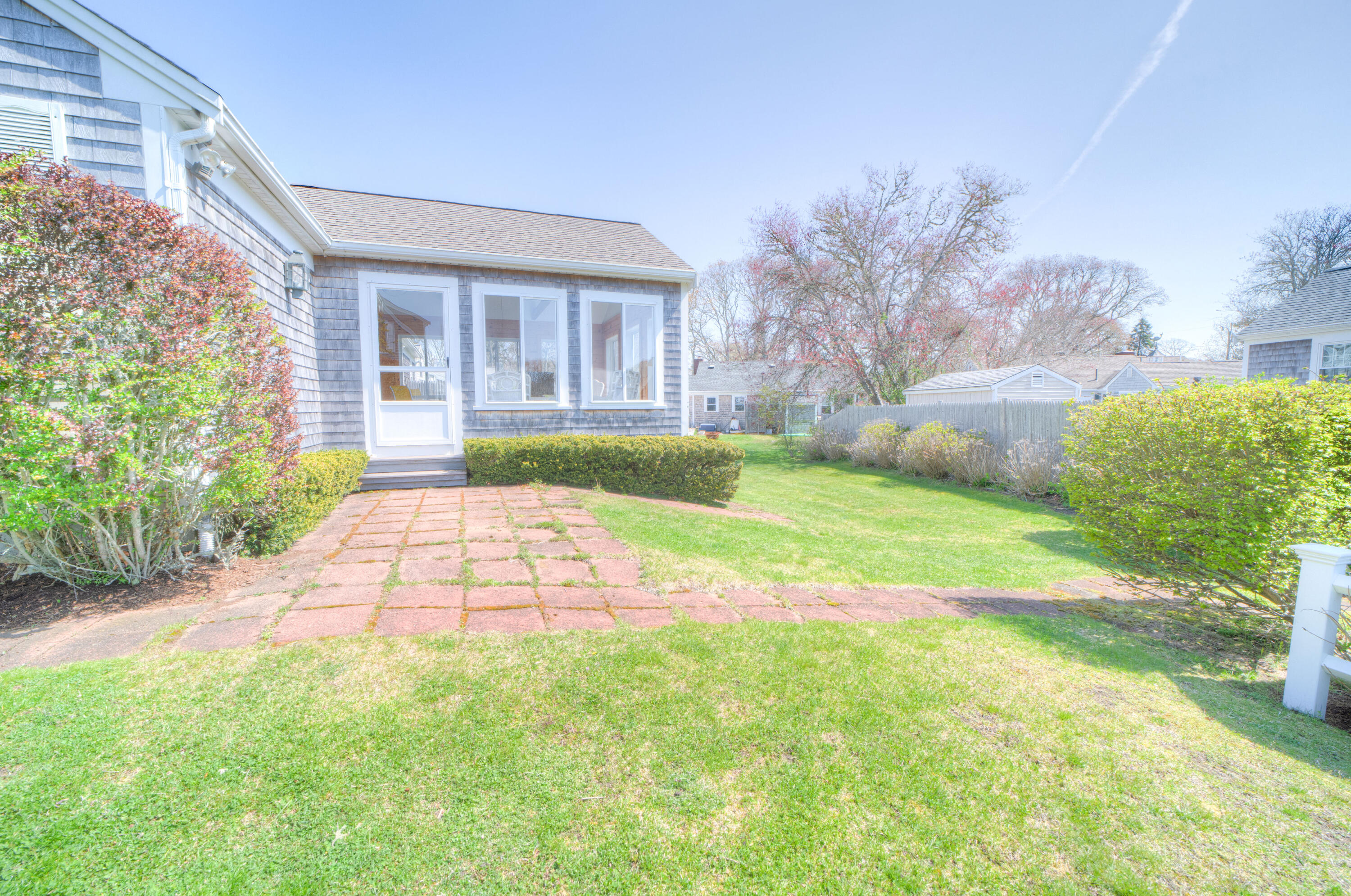 132 Indian Pond Road West Dennis, MA 02670 - Photo 3 of 21 a front view of a house with garden