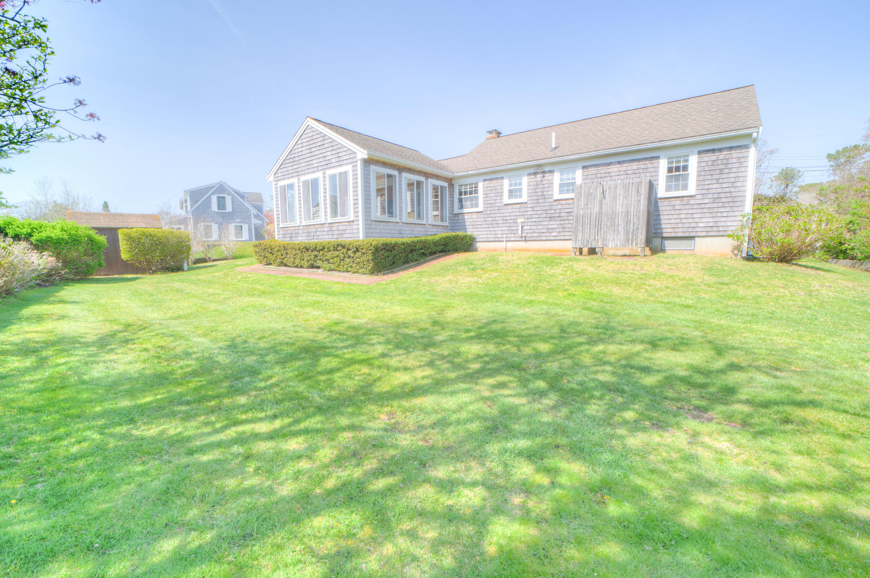 132 Indian Pond Road West Dennis, MA 02670 - Photo 4 of 21 a house view with a garden space