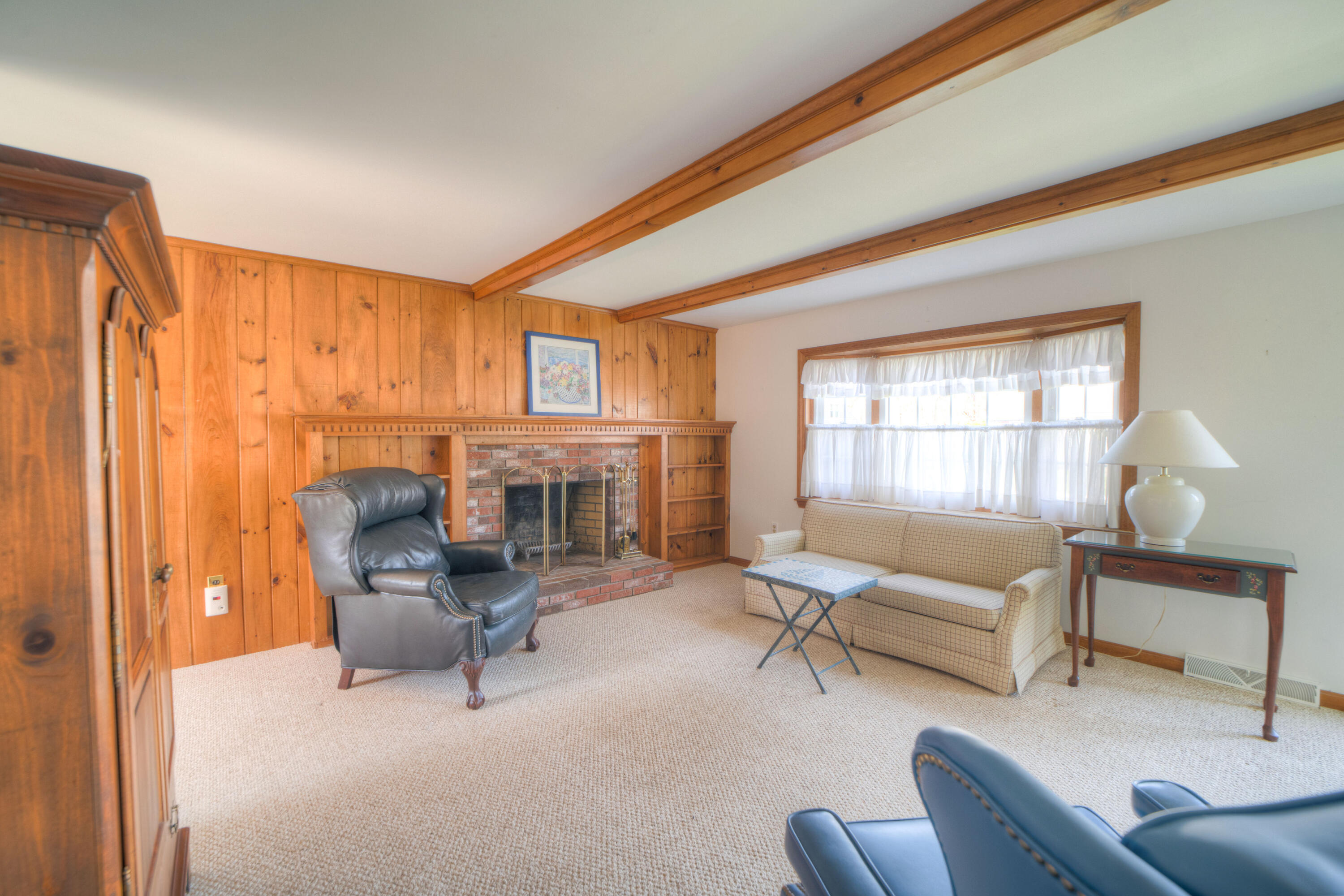 132 Indian Pond Road West Dennis, MA 02670 - Photo 6 of 21 a living room with furniture and a fireplace