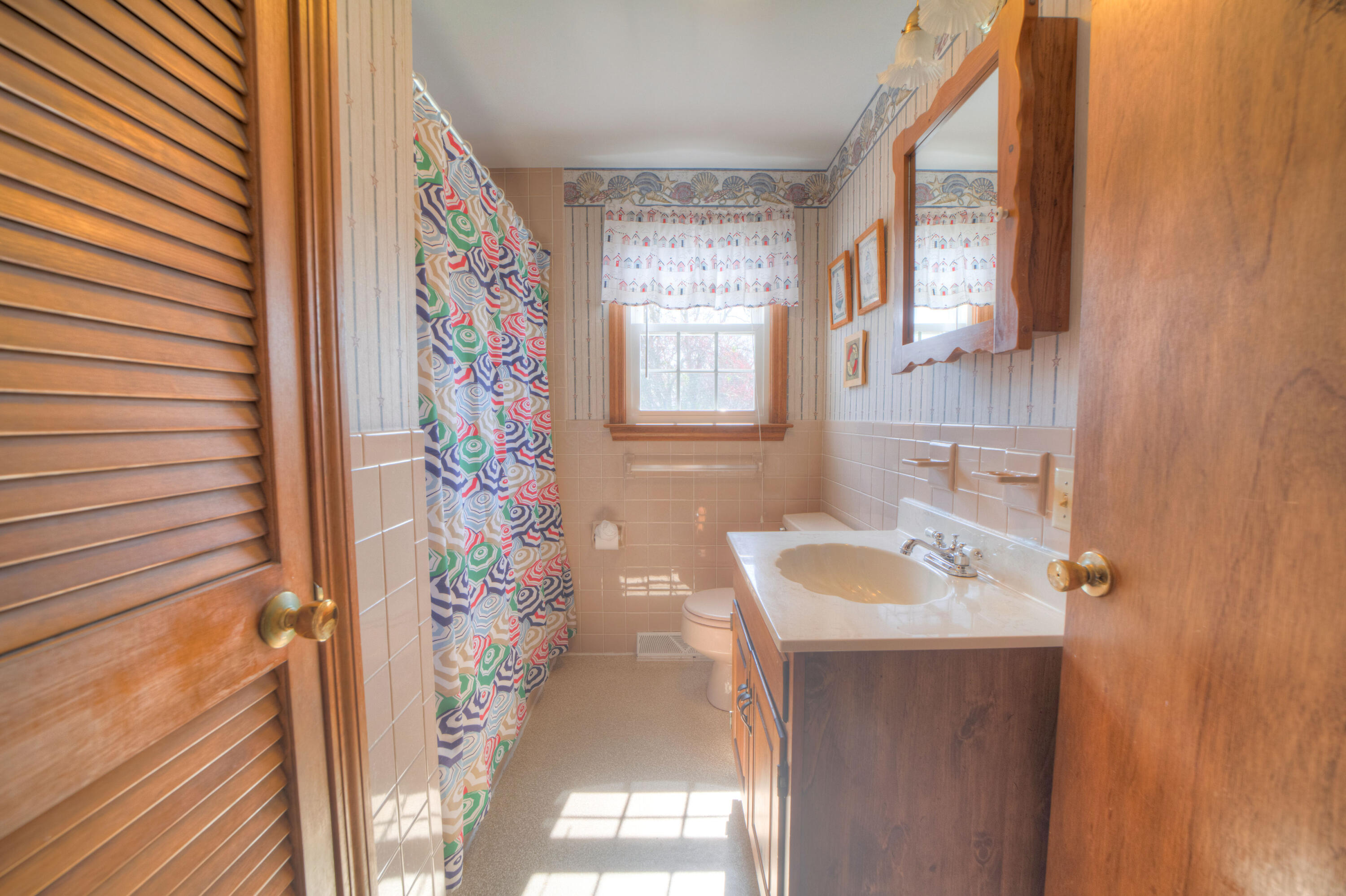 132 Indian Pond Road West Dennis, MA 02670 - Photo 8 of 21 a bathroom with a sink and a mirror