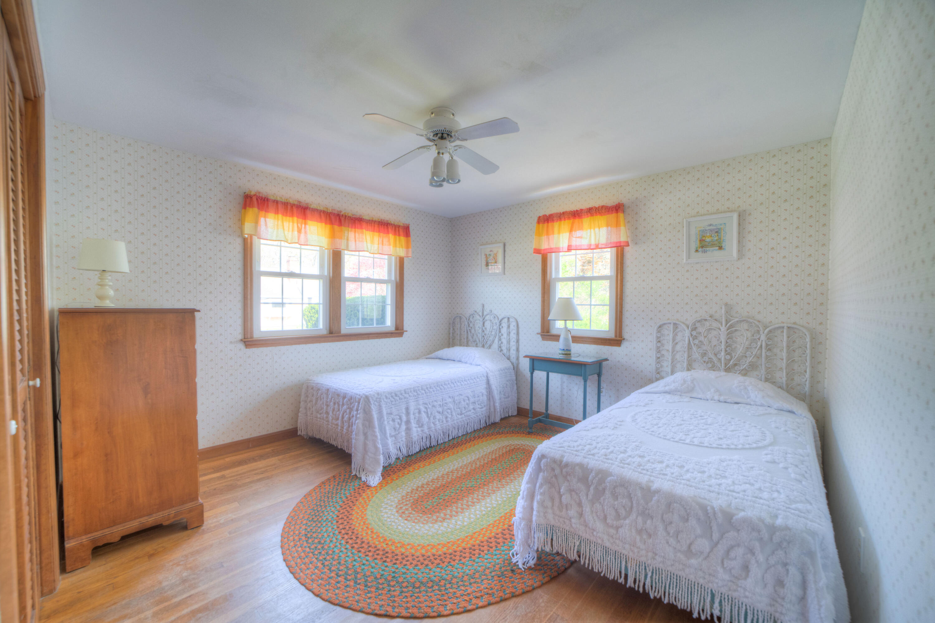 132 Indian Pond Road West Dennis, MA 02670 - Photo 9 of 21 a bedroom with two beds and a window
