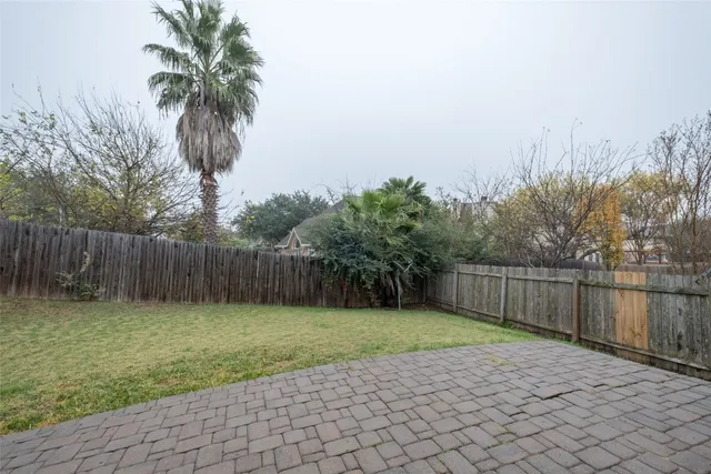 a swimming pool with wooden fence