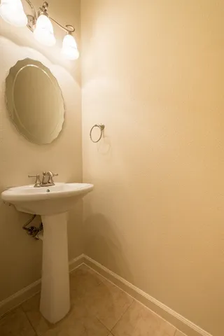 a bathroom with a sink and mirror