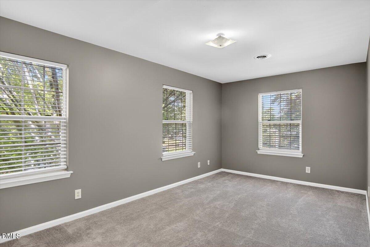 1630 Oxford Road, Unit F Henderson, NC 27536 - Photo 14 of 33 a view of an empty room with a window