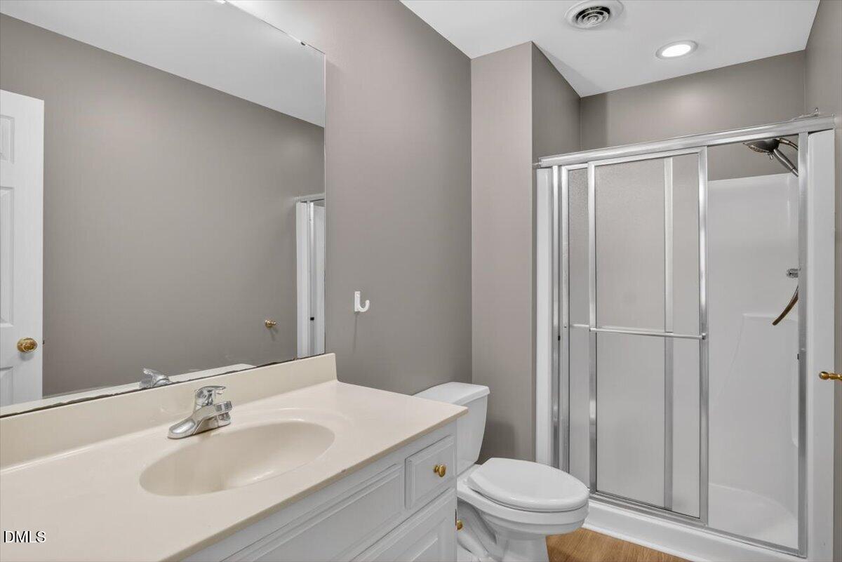 1630 Oxford Road, Unit F Henderson, NC 27536 - Photo 18 of 33 a bathroom with a sink toilet and shower