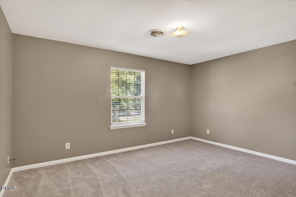 1630 Oxford Road, Unit F Henderson, NC 27536 - Photo 21 of 33 an empty room with a window
