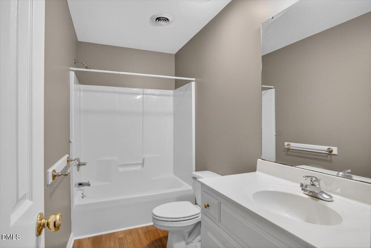 1630 Oxford Road, Unit F Henderson, NC 27536 - Photo 23 of 33 a bathroom with a sink toilet and shower
