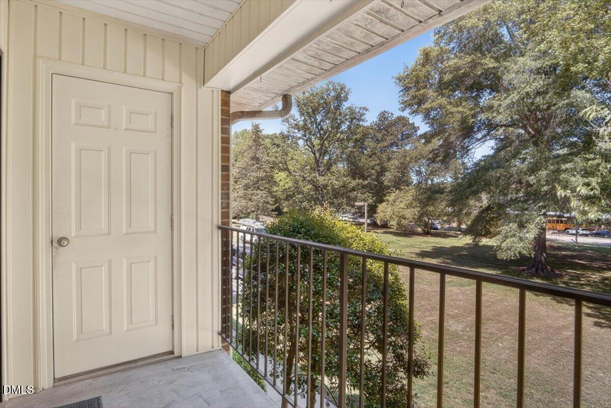 1630 Oxford Road, Unit F Henderson, NC 27536 - Photo 24 of 33 a view of a balcony with wooden floor and fence