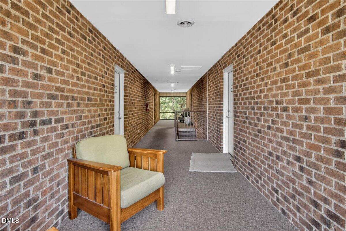 1630 Oxford Road, Unit F Henderson, NC 27536 - Photo 27 of 33 a view of a balcony with furniture