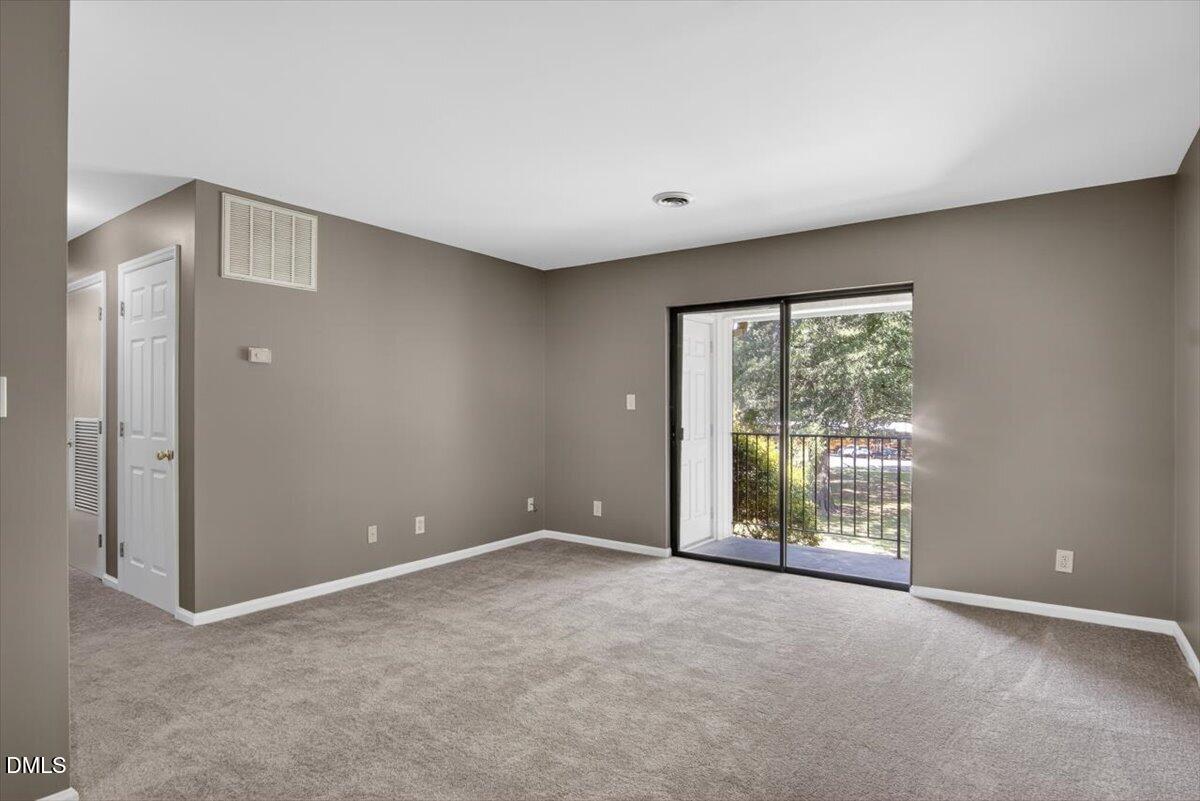 1630 Oxford Road, Unit F Henderson, NC 27536 - Photo 6 of 33 a view of an empty room with a window