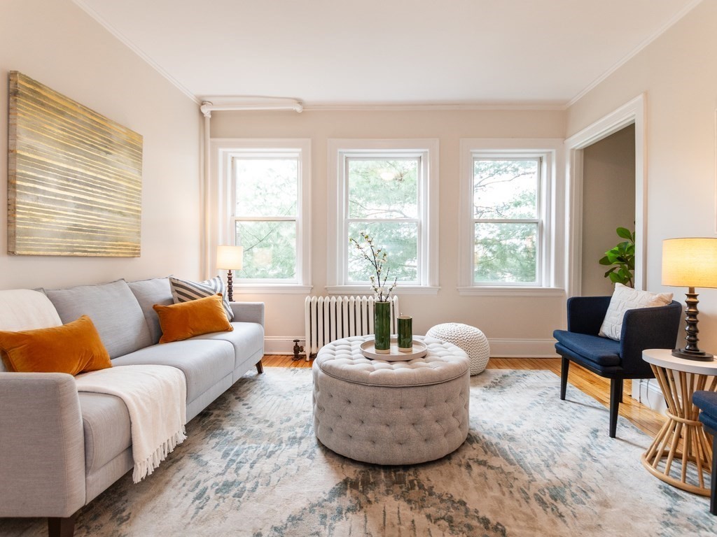 21 Chauncy Street, Unit 36 Cambridge, MA 02138 - Photo 1 of 28 a living room with furniture and a large window