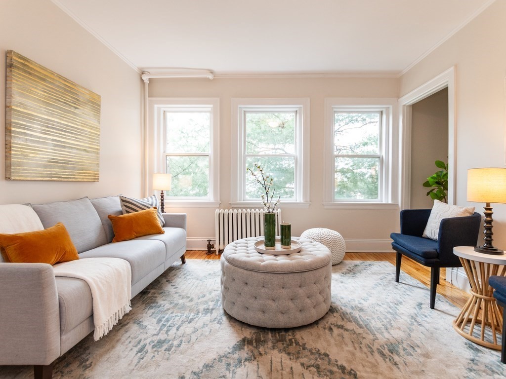 a living room with furniture and a large window