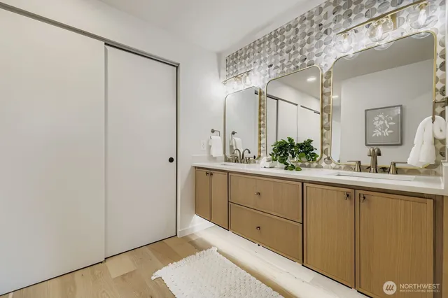 a bathroom with a sink and mirror