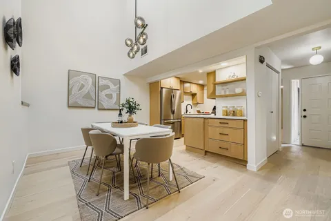 a view of a dining room kitchen and a wooden floor