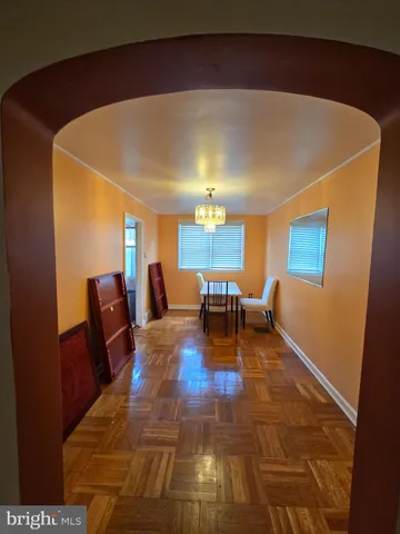 a living room with furniture and a pool table