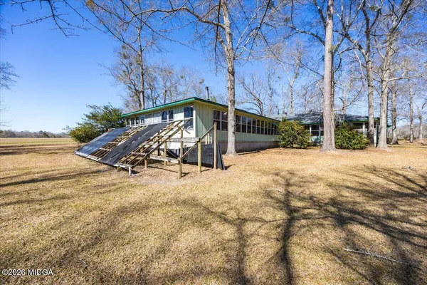 a living room with fireplace furniture and a flat screen tv