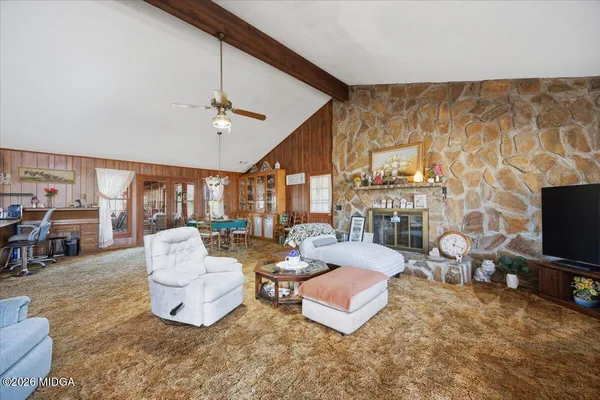 a kitchen with cabinets appliances a sink and a window