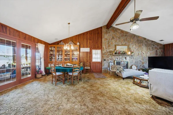 a bed sitting in a room next to a window